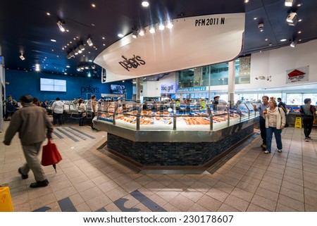 SYDNEY - Oct 16: People shop at Sydney Fish Market on Oct 16, 2014 in Sydney. It is the world\'s 3rd largest fish market, established in 1945 by the government and was privatized in 1994.