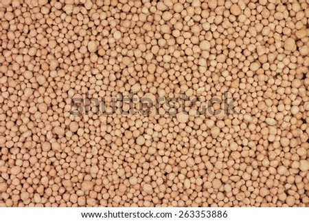 pink granules mineral fertilizers abstract background