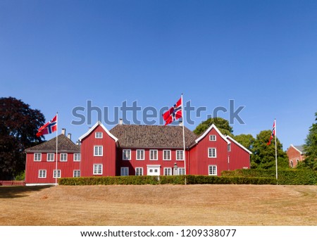 Red colored wooden Herregarden Manor House, one of Norway’s finest secular Baroque structures in Larvik, Vestfold County, Norway