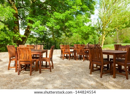Tables and chairs of outdoor cafe in England
