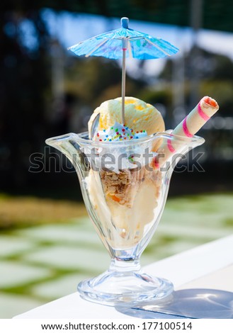 Caramel ice cream in cup outdoors
