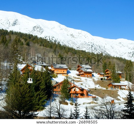 Chalets and ski lift cabin at Alpine ski resort