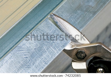 Cutting steel stud with tin snip cutter