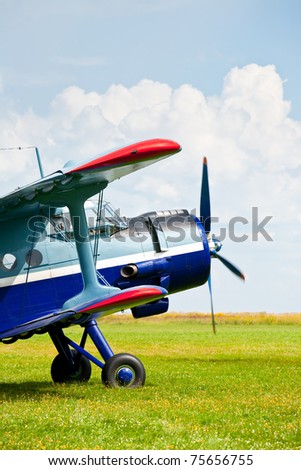 Vintage single-engine biplane aircraft ready to take off
