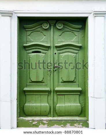 Old weathered green wooden door