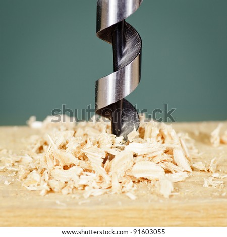 Wood drill bit with shaving