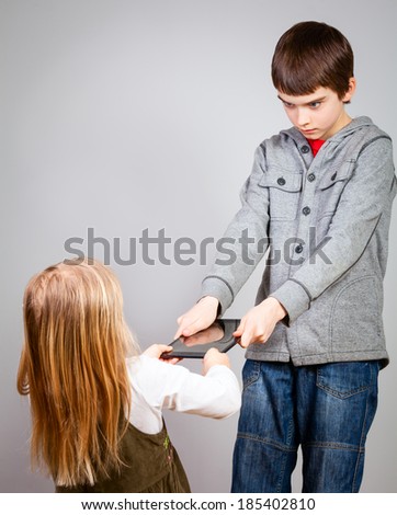Boy dont want to share a touch pad with little sister