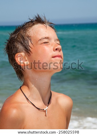 Kid sun tanning on a beach
