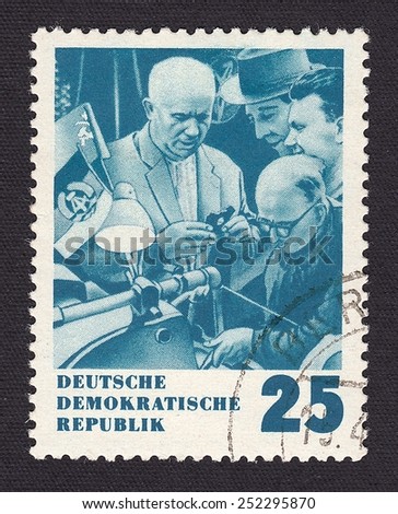 GERMANY- CIRCA 1959: stamp printed by Germany, shows Khrushchev with a friendly visit to the GDR.Meeting with workers at one of the national enterprises, circa 1959