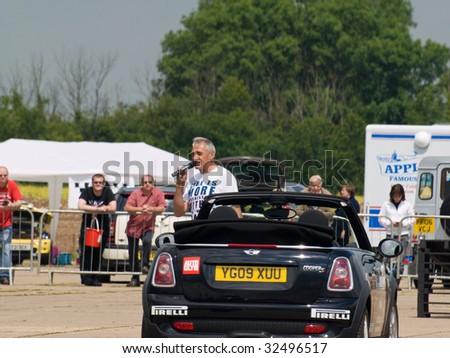 GRIMSBY, ENGLAND - JUNE 21: Stunt car driver Russ Swift entertains the crowds in his Mini Cooper at the New Mini Day, Manby Park,Grimsby in aid of Help For Heroes Charity, June 21st 2009