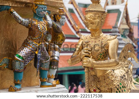 The statue of Thai demon carrying the golden pagoda at Wat Phra Kaew, Temple of the Emerald Buddha, Bangkok, Thailand