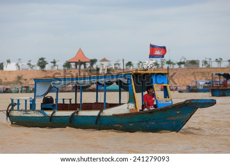 SIEM REAP, CAMBODIA : Cambodian people live beside Tonle Sap Lake in Siem Reap, Cambodia on June 10, 2013. This is the largest freshwater lake in SE Asia peaking. Annual flooding of the village.