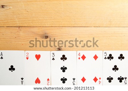 Poker cards on wood