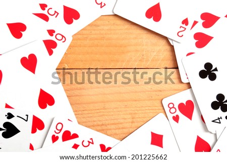 Poker cards on wood background