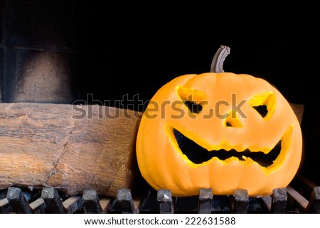 Halloween pumpkin in a fireplace