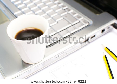 Computer and coffee in the office table