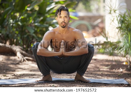 Young man does yoga in nature./Yoga in nature.