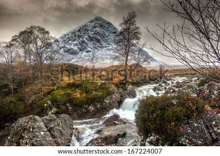 The mountain is Buachaille Etive Mor which rises above Rannoch Moor to a height of 1022m It is located in  Glencoe in the Lochaber region of Scotlands Highlands