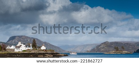 A sight seeing boat on Loch Carron off the coast of Plockton in the Scottish Highlands
