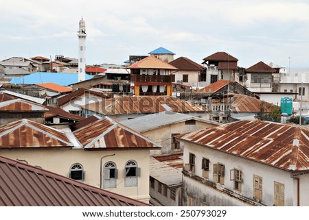 A view across the rusted corrugated iron roofs of Stone Town in Zanzibar, Tanzania.