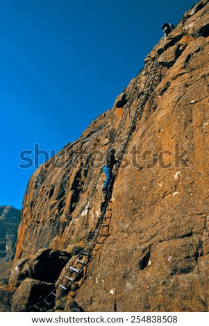 Hikers climb up a set of chain ladders on the side of a cliff on their way up to the top of The Amphitheater in the Drakensberg Mountain range, a Unesco World Heritage Site in South Africa.
