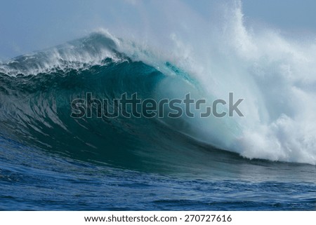 A beautiful blue wave crashes down at one of the world\'s premier big wave surfing spots, Dungeons in Cape Town, South Africa.