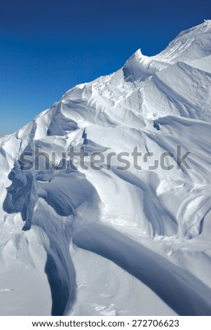 A pile of snow piled up in a winter landscape.