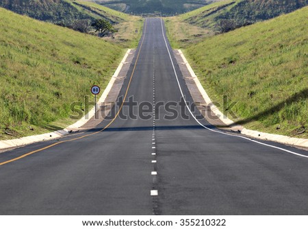 A highway stretches off into the distance.