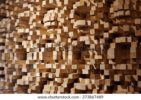 An acoustic diffuser made out of wooden tinder blocks mounted on a wall in a music industry recording studio.