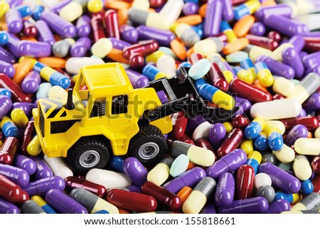 Industrial loader tractor toy load pills (Installation on the theme of modern medicine)