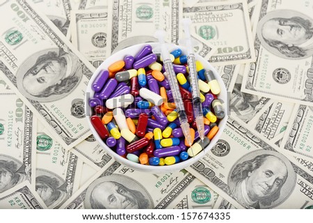 Plate full of pills, tablets and syringes  (installation on the theme of modern medicine trends)