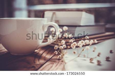 Books, Flowers And White Cup On Wooden Table