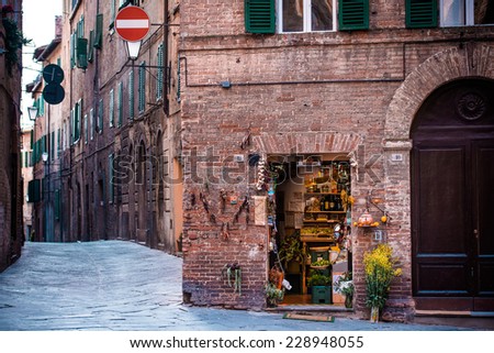 SIENA, ITALY - MARCH 29, 2014: Small grocery and souvenir shop in the old city center of Siena, Tuscany region, Italy