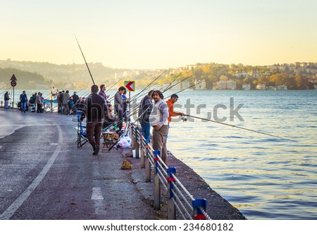 ISTANBUL, TURKEY - OCTOBER 24, 2014 : People fishing at Bosphorus strait near Istanbul, Turkey