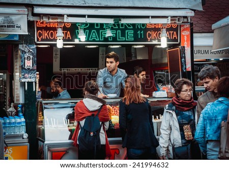 ISTANBUL, TURKEY -  october 23, 2014: Vendor sales ice-cream at street market in Ortakoy aquare in Istanbul, Turkey.