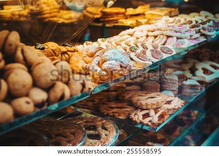 Various pastry type on shelf in bakery shop