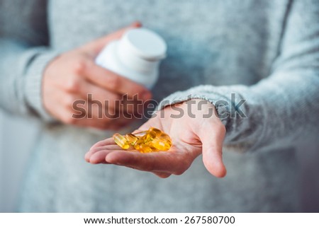 Pills in hands. Medicine and health care concept