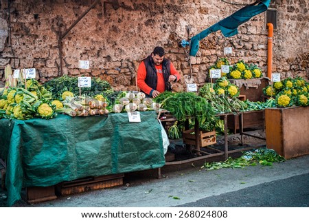 PALERMO, ITALY - MARCH 13, 2015:  Grocery shop at famous local market Ballaro in Palermo, Italy