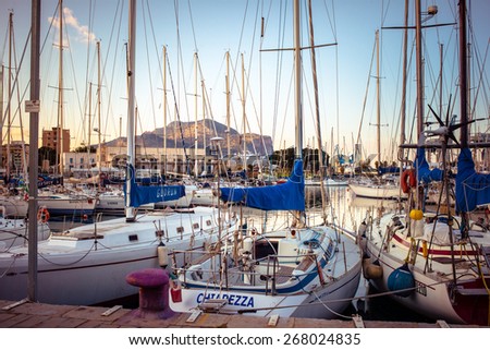PALERMO, ITALY - MARCH 14, 2015: Boats and yachts parked in La Cala bay, old port in Palermo, Italy