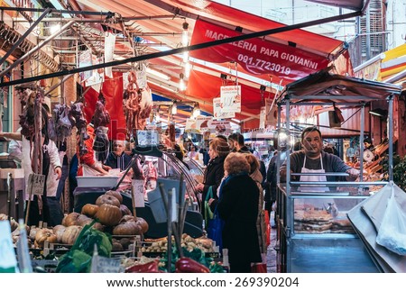 PALERMO, ITALY - MARCH 13, 2015: Butcher sells meat at famous local market Ballaro in Palermo, Italy
