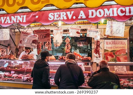 PALERMO, ITALY - MARCH 13, 2015: People shop at famous local market Ballaro in Palermo, Italy