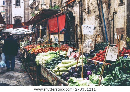 PALERMO, ITALY - MARCH 13, 2015:  Grocery shop at famous local market Ballaro in Palermo, Italy. Toned picture with matte effect