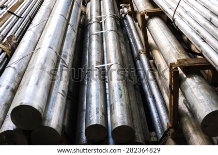 Stacked aluminum metal pipes. Heavy industry production
