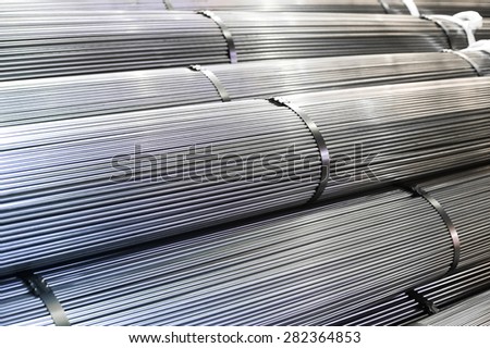 Stacked aluminum  metal rods. Heavy industry production