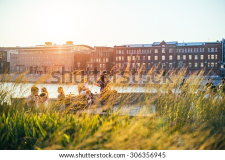 MOSCOW, RUSSIA - AUGUST 9, 2015: Young people enjoy the sunset in Muzeon park in Moscow, Russia. Toned picture
