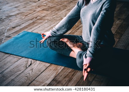 Young woman meditates while practicing yoga. Freedom concept. Calmness and relax, woman happiness.