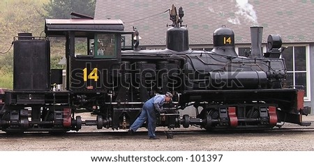 Engineer cleaning Steam Engine, Silver Plume, Colorado