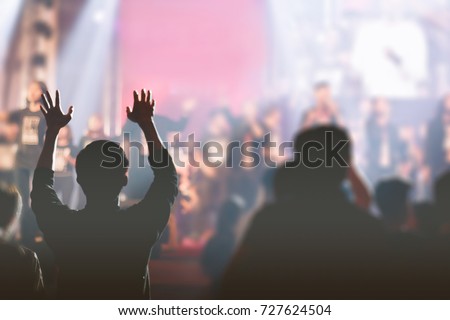 Christian worship with raised hand,music concert