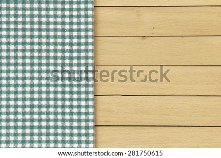 Checkered Tablecloth On The Wooden Background./ Checkered Tablecloth On The Wooden Background.