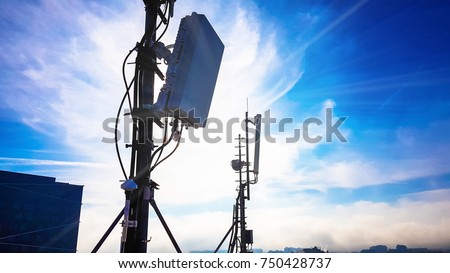 Silhouette of 5G smart cellular network antenna base station on the telecommunication mast